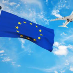 EU flag and an aeroplane in the sky