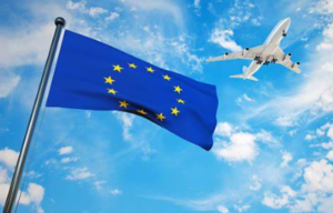 EU flag and an aeroplane in the sky